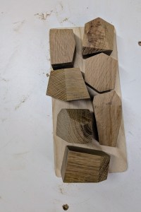 Overhead of knolling rocks on a tray.