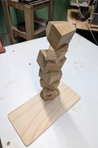 Stacked knolling rocks on a tray.
