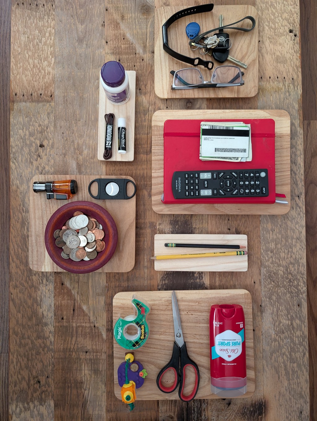 Arranged items on knolling trays.