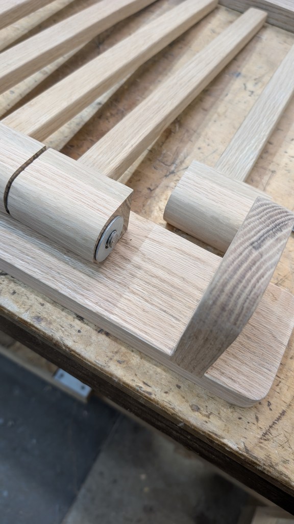 Inserting the last arm when mounting the clothing rack to the wal