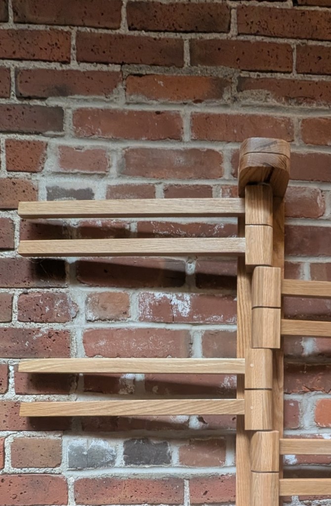 Wall mounted clothing rack arms swing 180 degrees