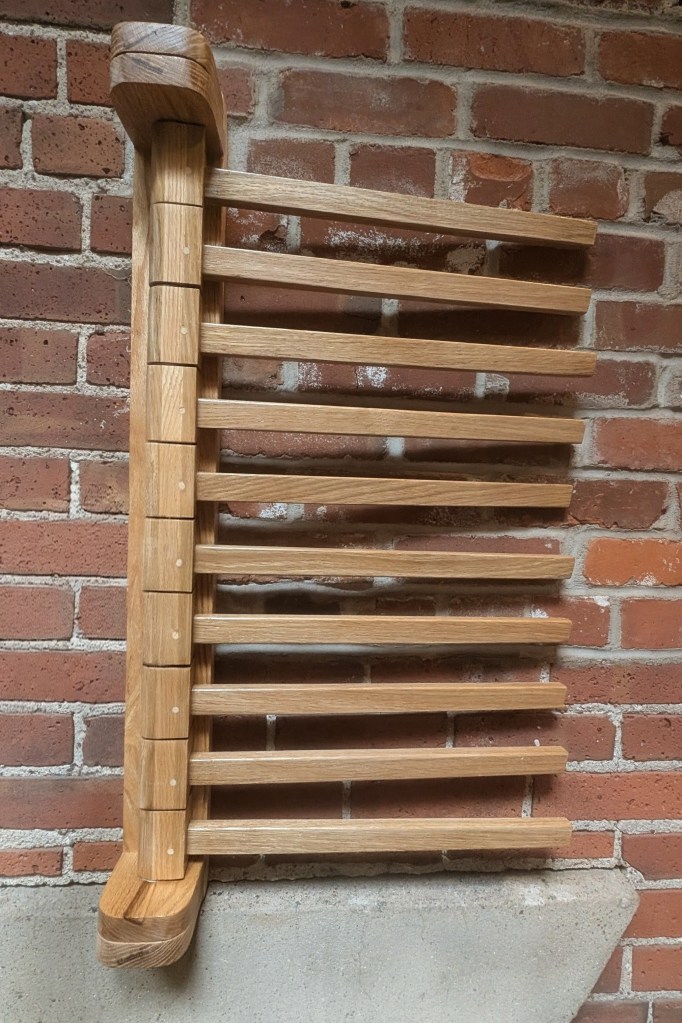 Front view of wall mounted clothing rack