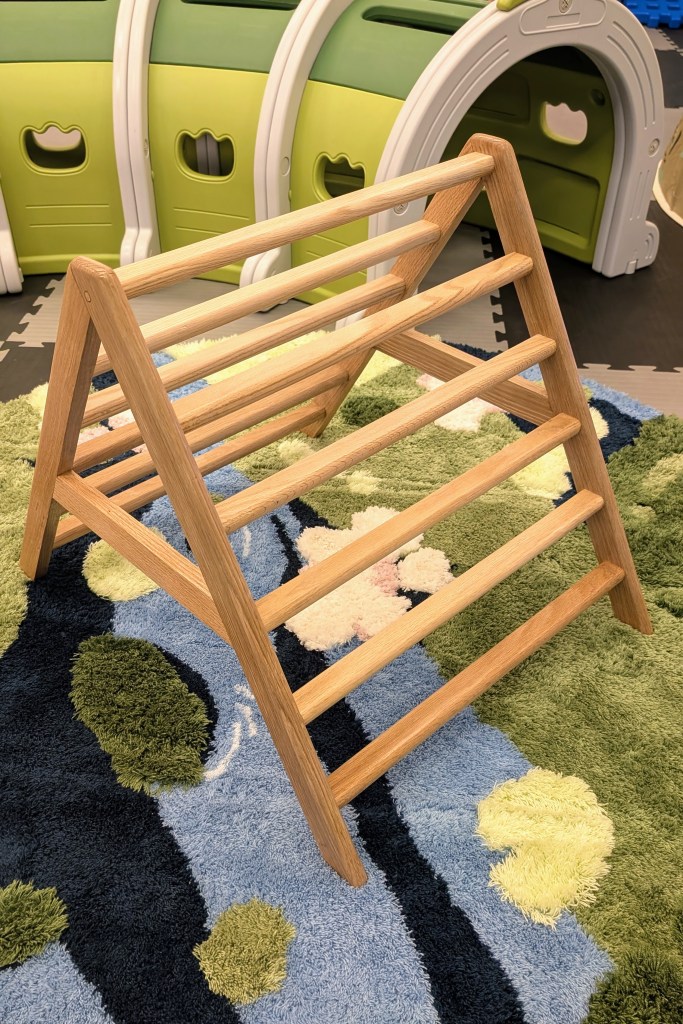 Small kids climbing triangle at Hullabaloo in Stillwater