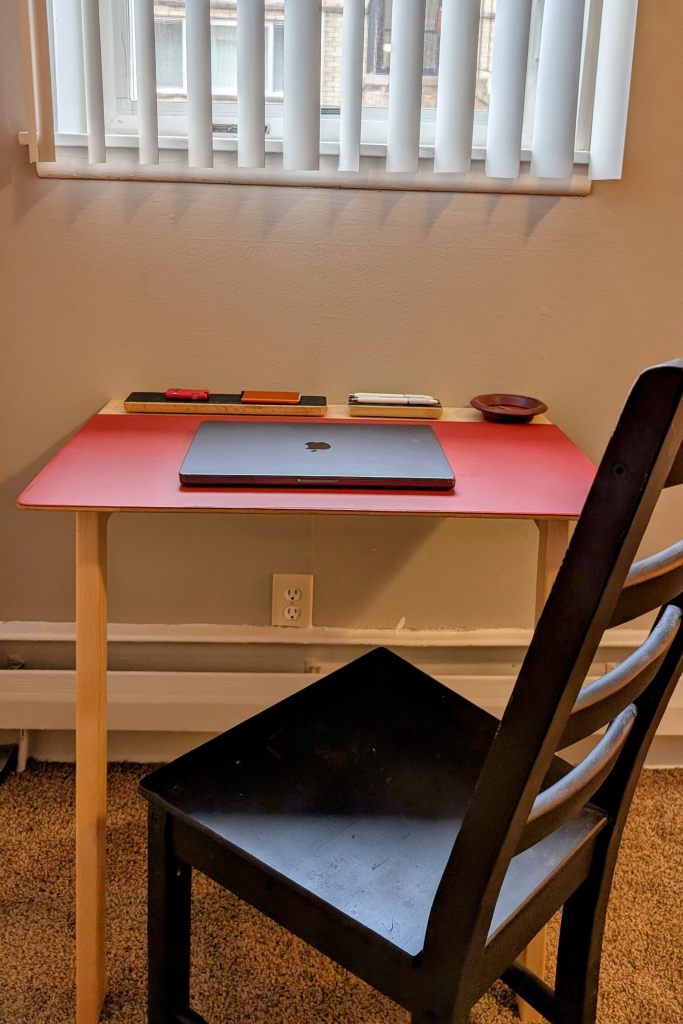 Front view in situ of compact writing desk